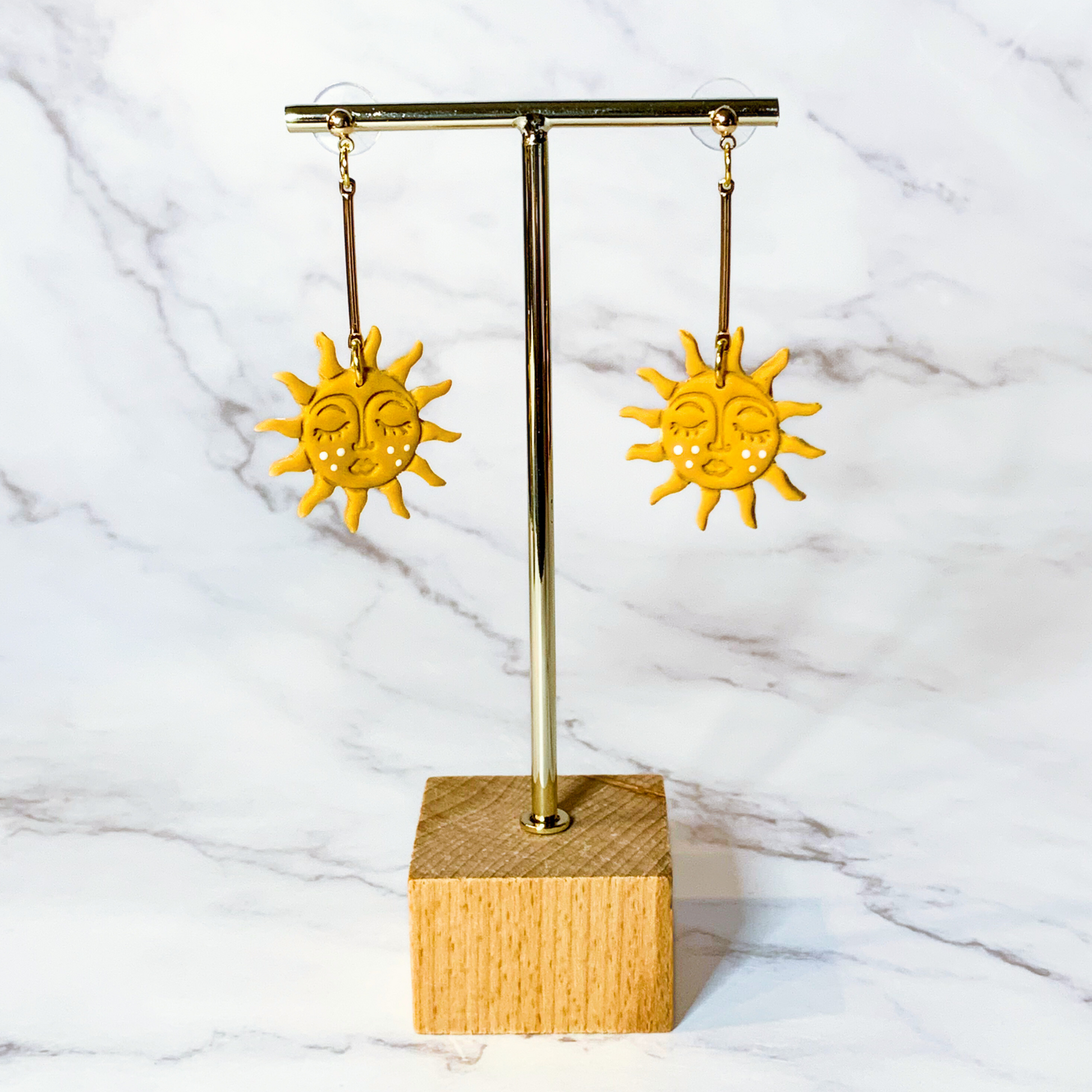 face sun earrings