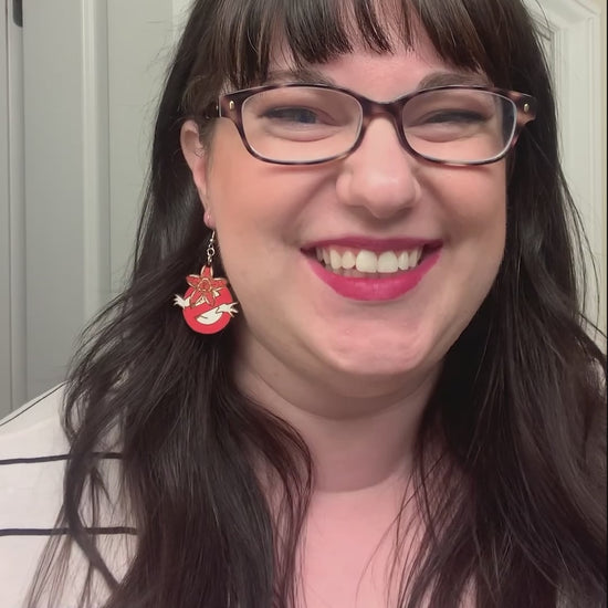 woman wearing Demogorgon Stranger Things earrings