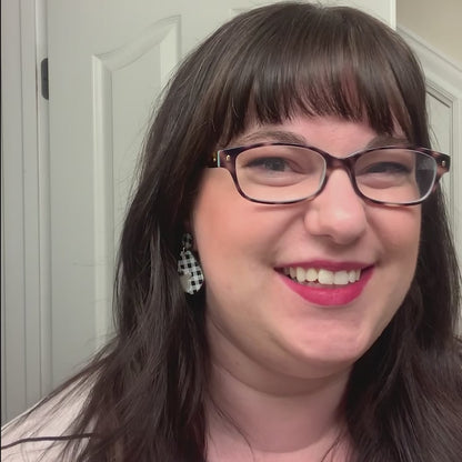 video of woman wearing ghost jewelry Halloween earrings