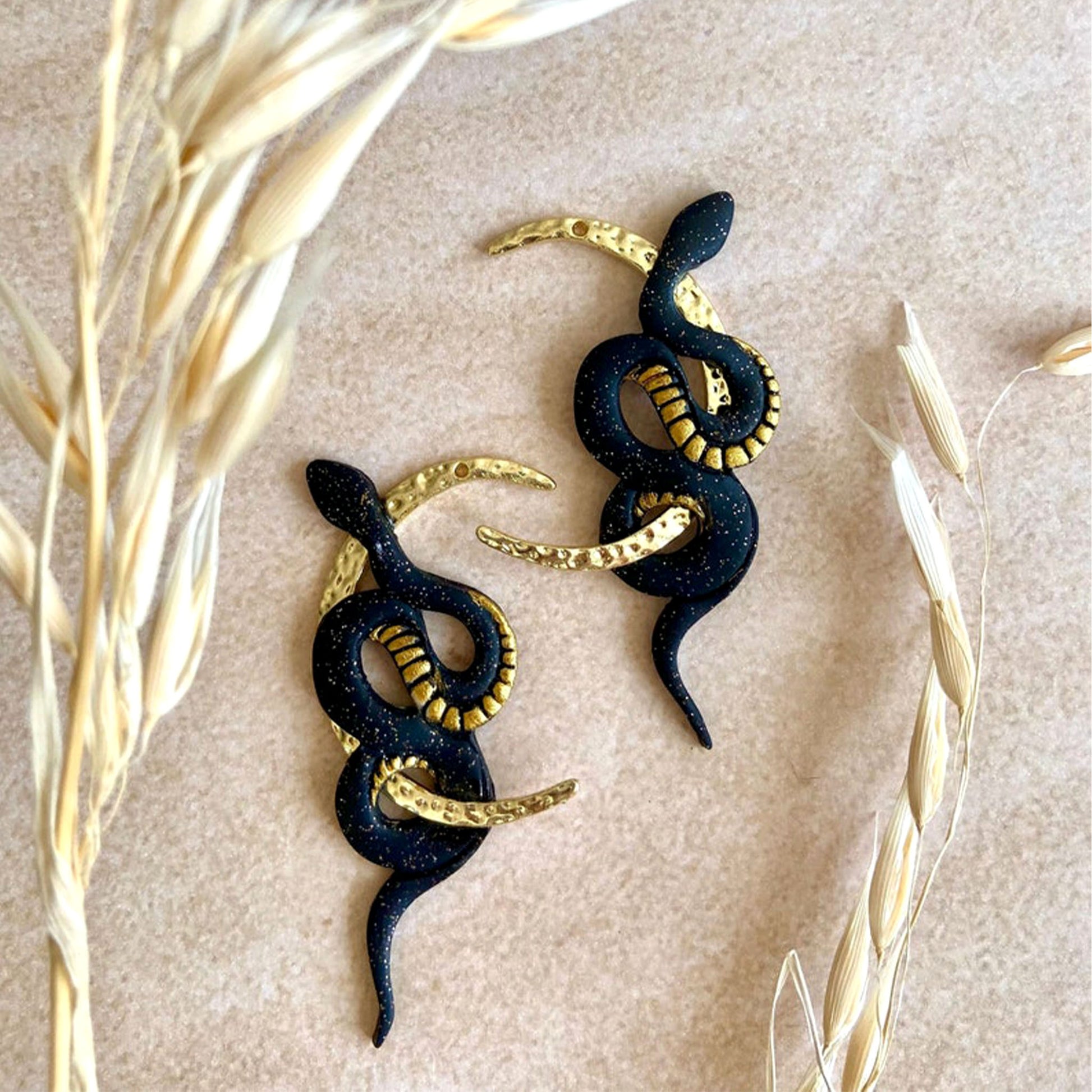 statement black moon snake earrings