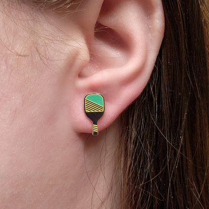 woman wearing pickleball earrings