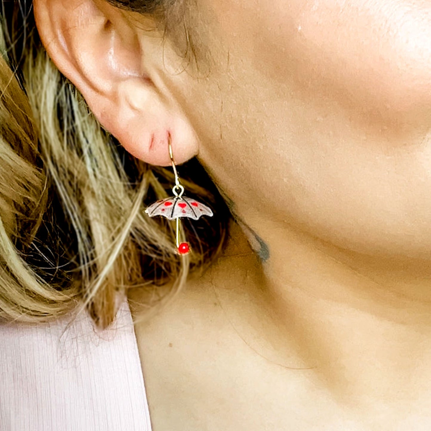 women wearing umbrella earrings