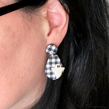 woman wearing ghost jewelry Halloween earrings